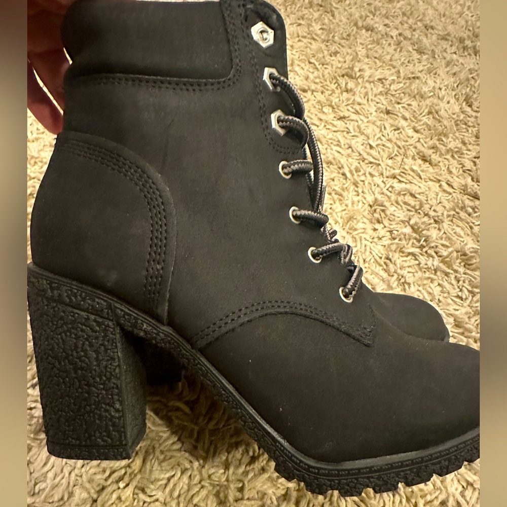 Whitemt black lace up booties.